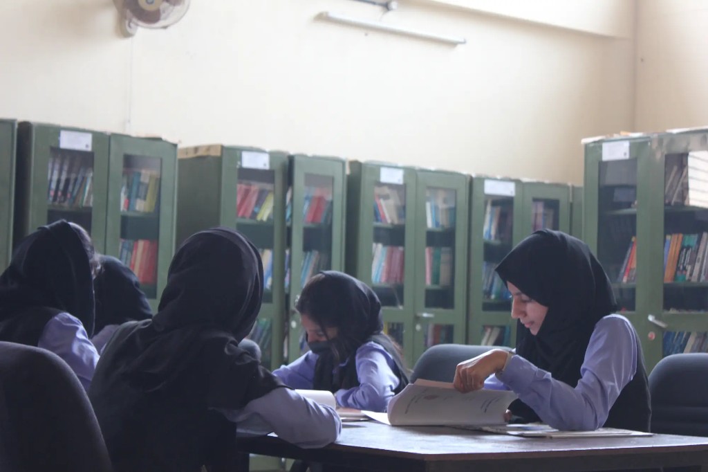Students studying in the central library reading room at KMCT College of Engineering for Women